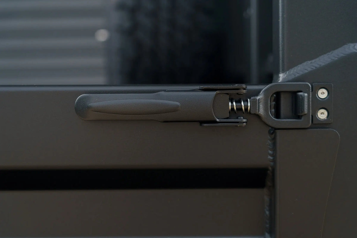Close up of black over centre latch on a Rock Solid tray side