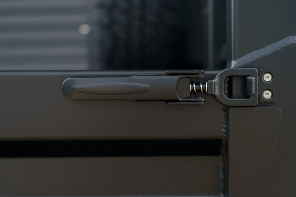 Close up of black over centre latch on a Rock Solid tray side